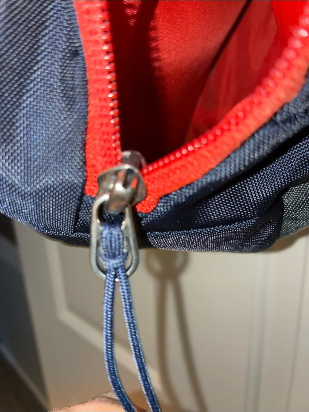 Patagonia Atom Sling 8L crossbody pack in a navy blue